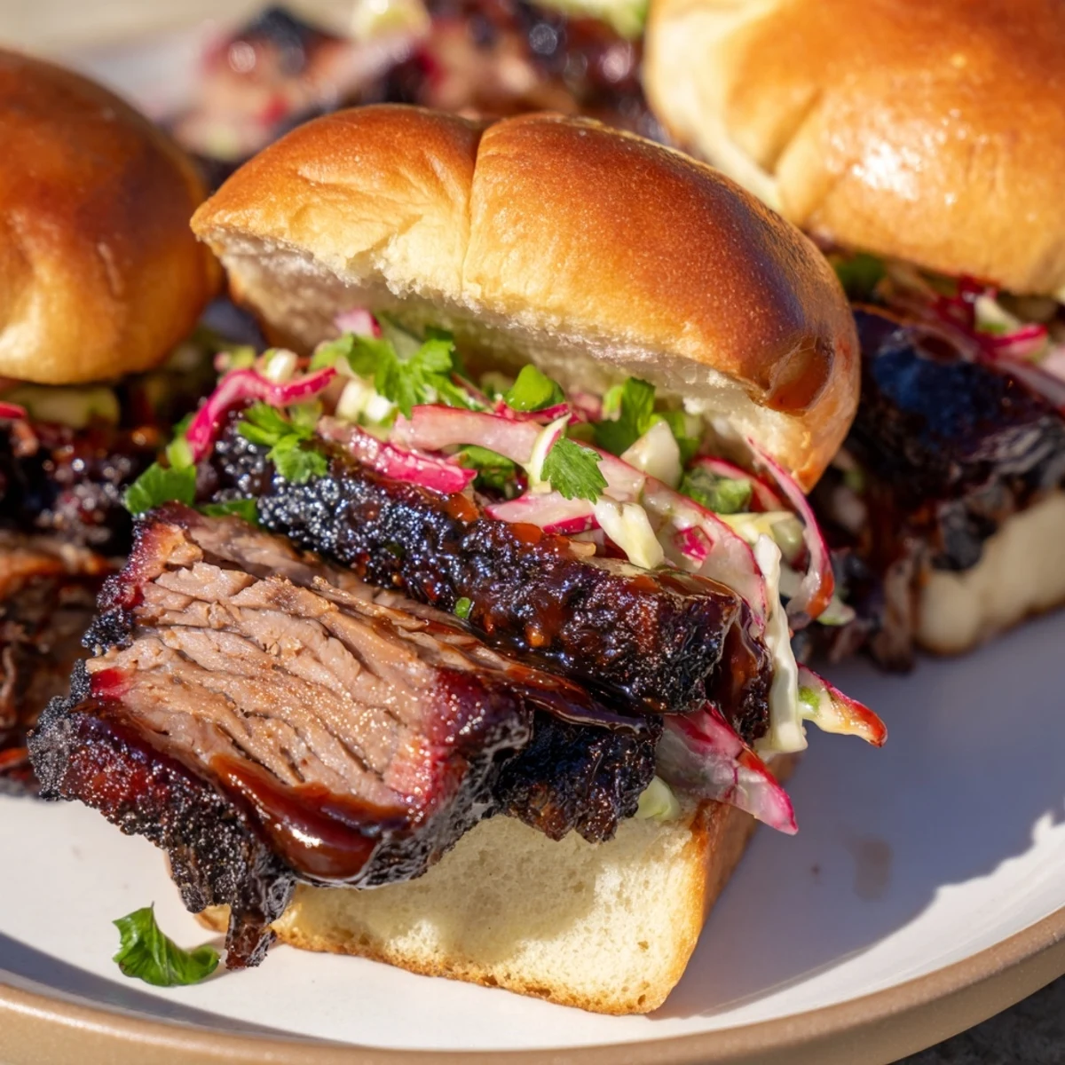 Fire-Kissed BBQ Pulled Pork Sandwiches, piled high on toasted buns, dripping smoky barbecue sauce.