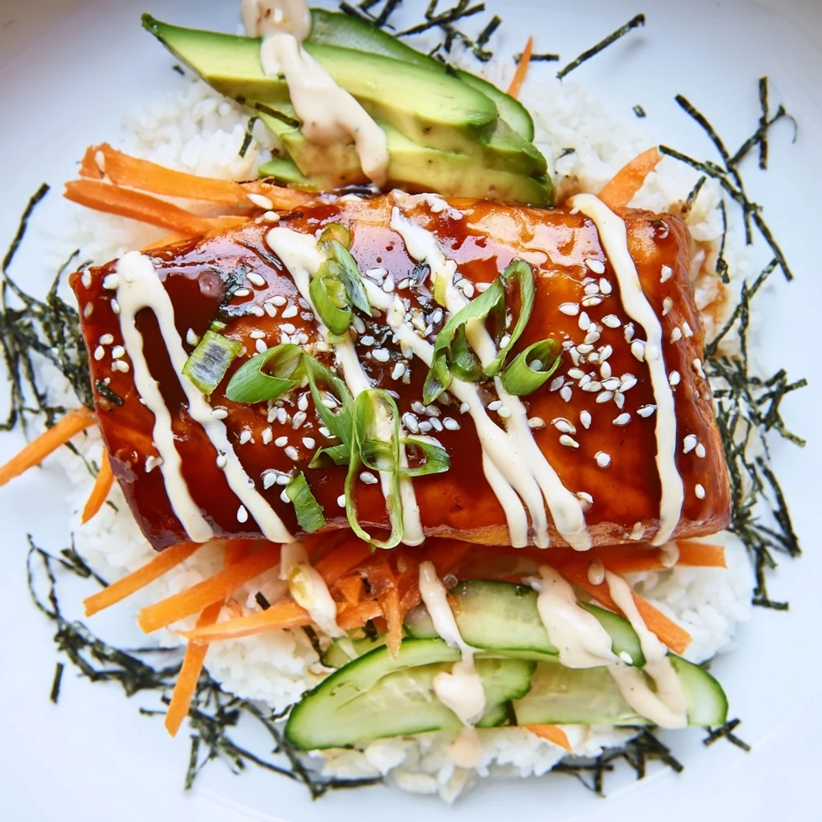 Delicious Teriyaki Salmon Rice Bowl, featuring perfectly cooked salmon atop fluffy rice with creamy mayo.