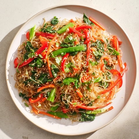 Bright red peppers and green snap peas mingle with crunchy kelp noodles in this low-calorie stir-fry.