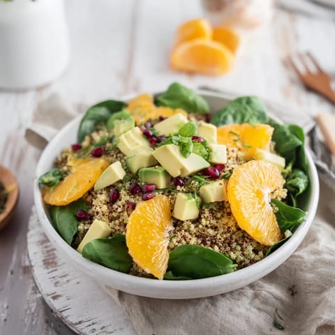 Enjoy a healthy serving of fresh Citrus & Avocado Quinoa Bowl drizzled with a light lemon dressing.