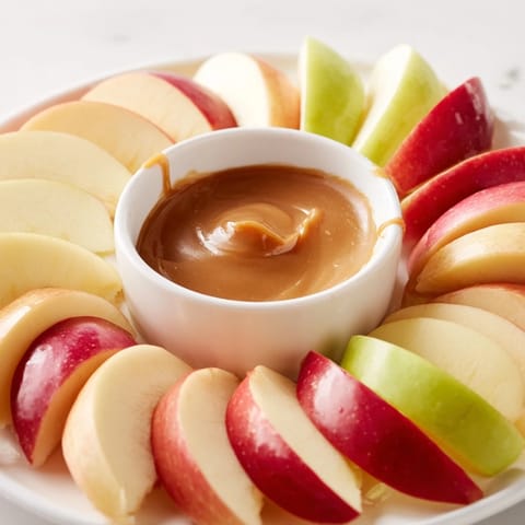 Enjoy delicious Apple Slices with Caramel Dip served as a delightful snack or dessert.