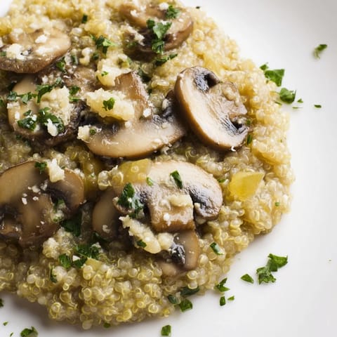 Earthy mushroom-filled Mushroom Quinoa Risotto, a vegetarian delight, garnished and ready to serve.
