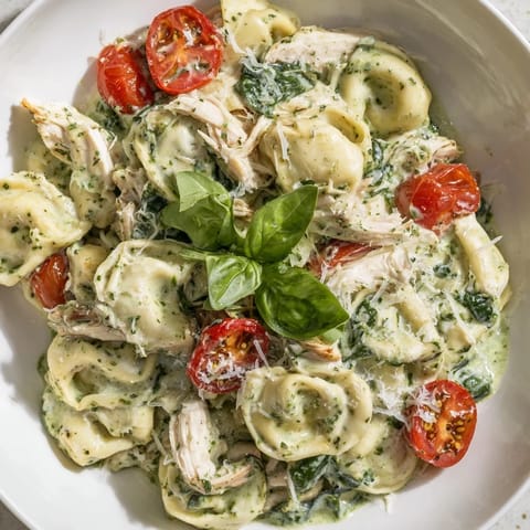 Sautéed spinach and halved cherry tomatoes add fresh color to this Italian-American dinner.