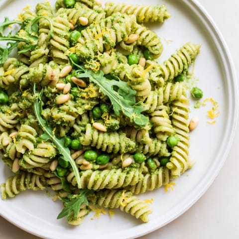 A chilled pasta salad served in a bowl, perfect for a sunny picnic or light lunch.
