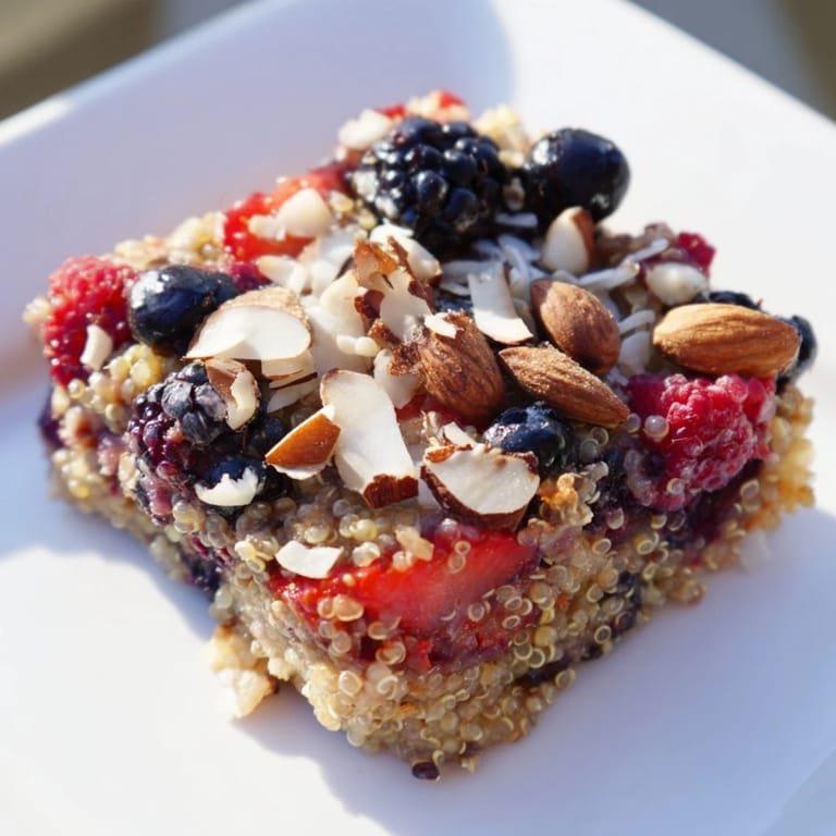 A baked dish of sweet and hearty Berry Quinoa Breakfast Bake, perfect for a cozy morning meal.