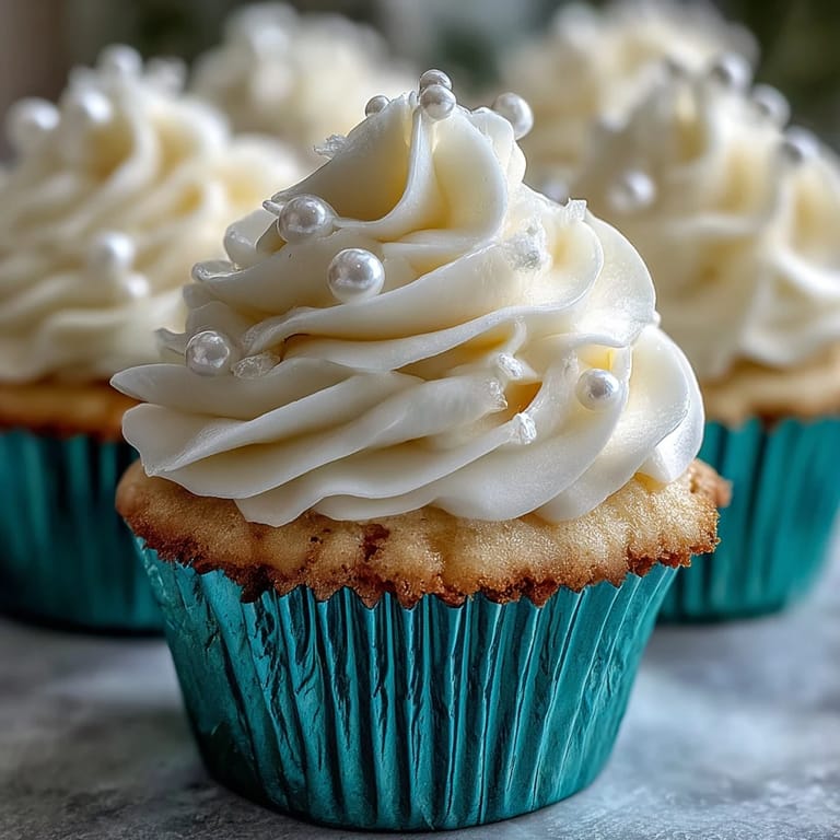 Glistening pearl fondant tops these Cancer Birthday Cupcakes, a sweet celebration.