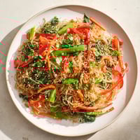 Bright red peppers and green snap peas mingle with crunchy kelp noodles in this low-calorie stir-fry.